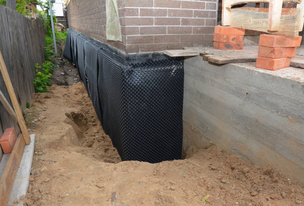 Happy homeowners after waterproofing job in El Dorado